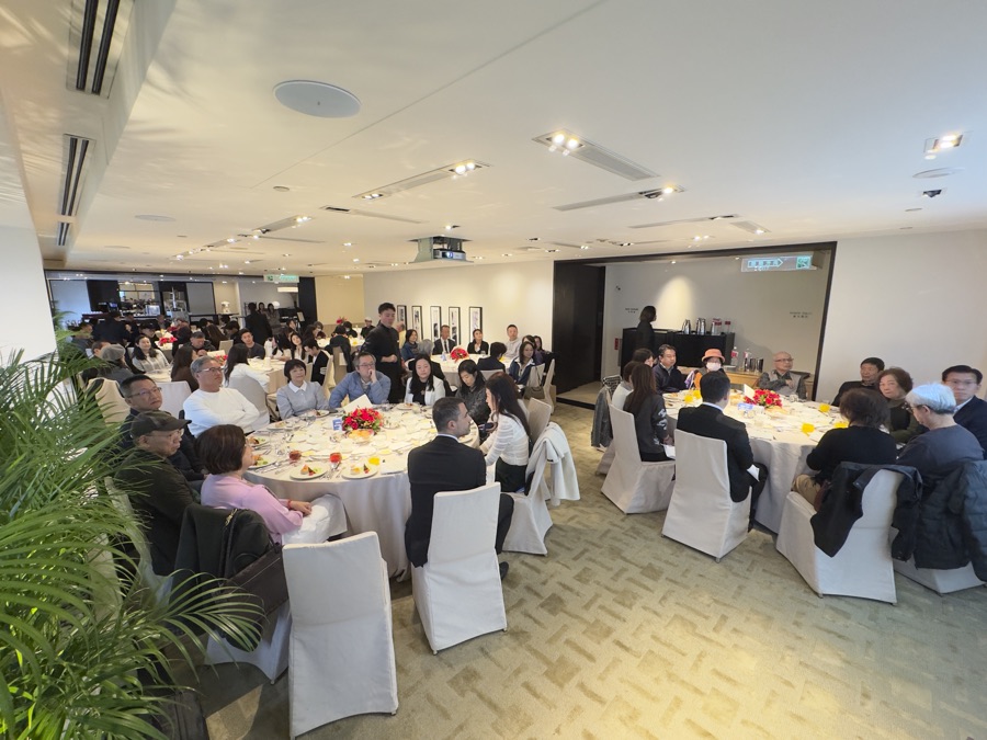 Roadshow luncheon session in Taipei: guests seated at round tables with white chair covers in a daylight dining room